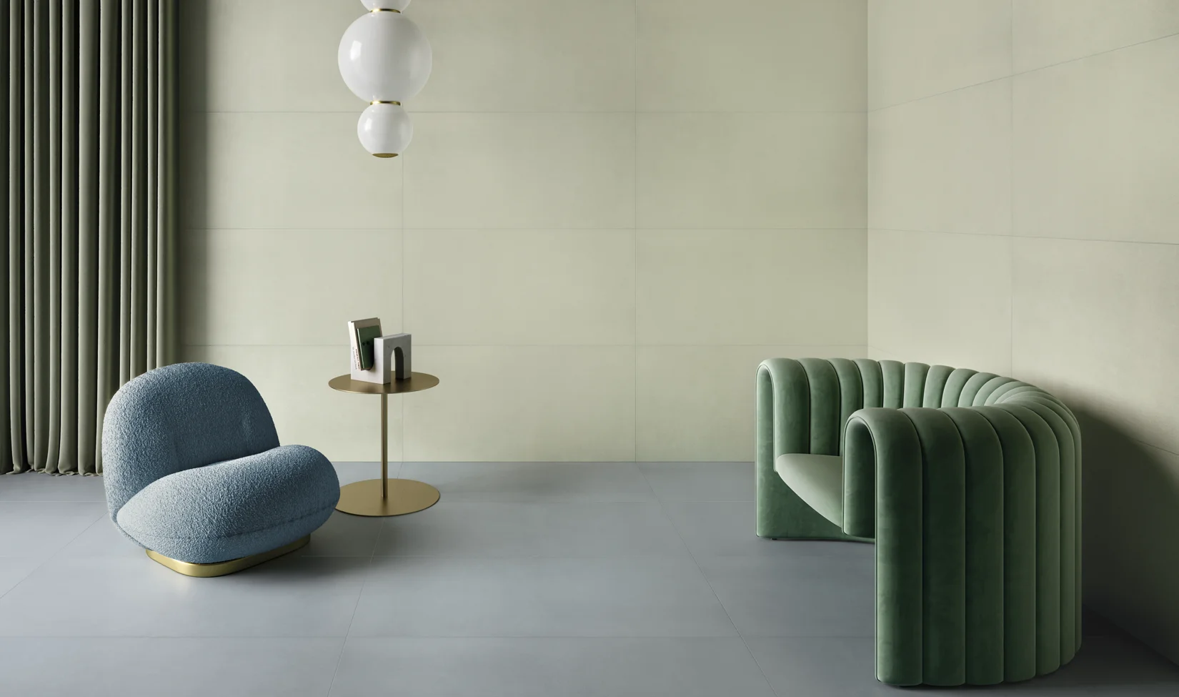Salotto minimalista con pavimento in gres porcellanato Elements design colore avio, divani moderni sage, lampada a sospensione e tavolino.