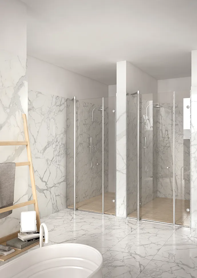 Bright bathroom featuring a shower clad in marble effect porcelain stoneware, adding a touch of elegance and style.