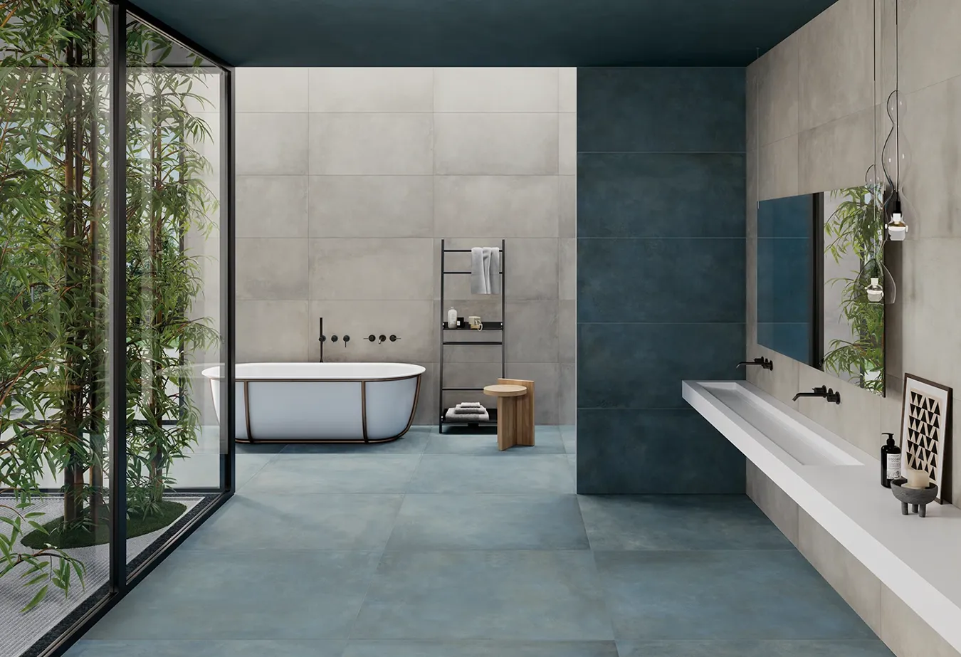 Bagno minimalista con piastrelle effetto metallo della collezione Plate, pavimento colore Titanium e arredi eleganti.