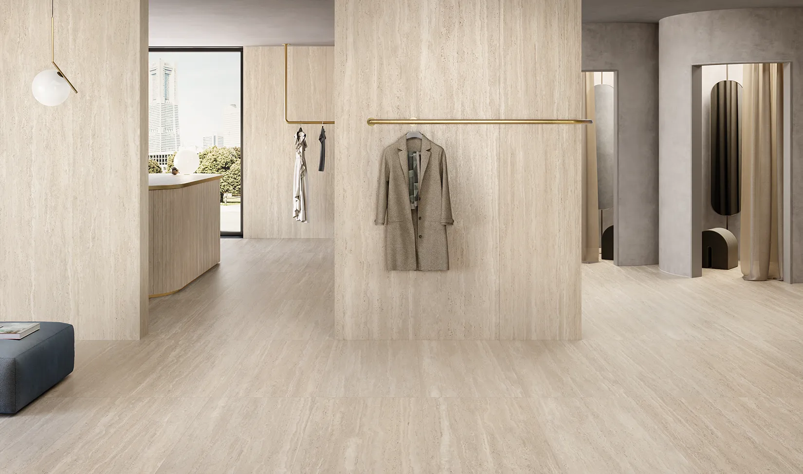 Floor and wall with Walnut travertine-effect tiles from the Trevi collection in a modern office with hanging jacket and cityscape.