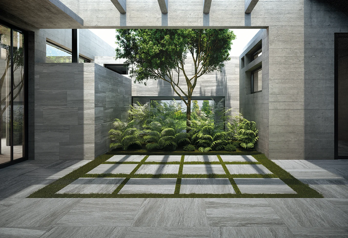 Giardino moderno con pavimentazione e pareti in piastrelle effetto pietra di diversi formati, circondato vegetazione lussureggiante.